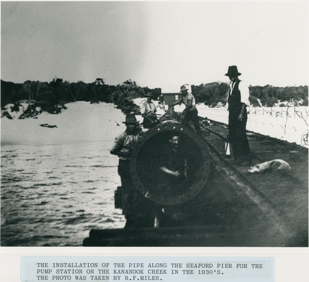 Installation of pipe along Seaford pier, 1930's 