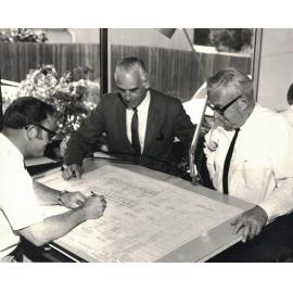 Frank Holmes, City Engineer; Arch Steel, Deputy Engineer; and Peter Stennett